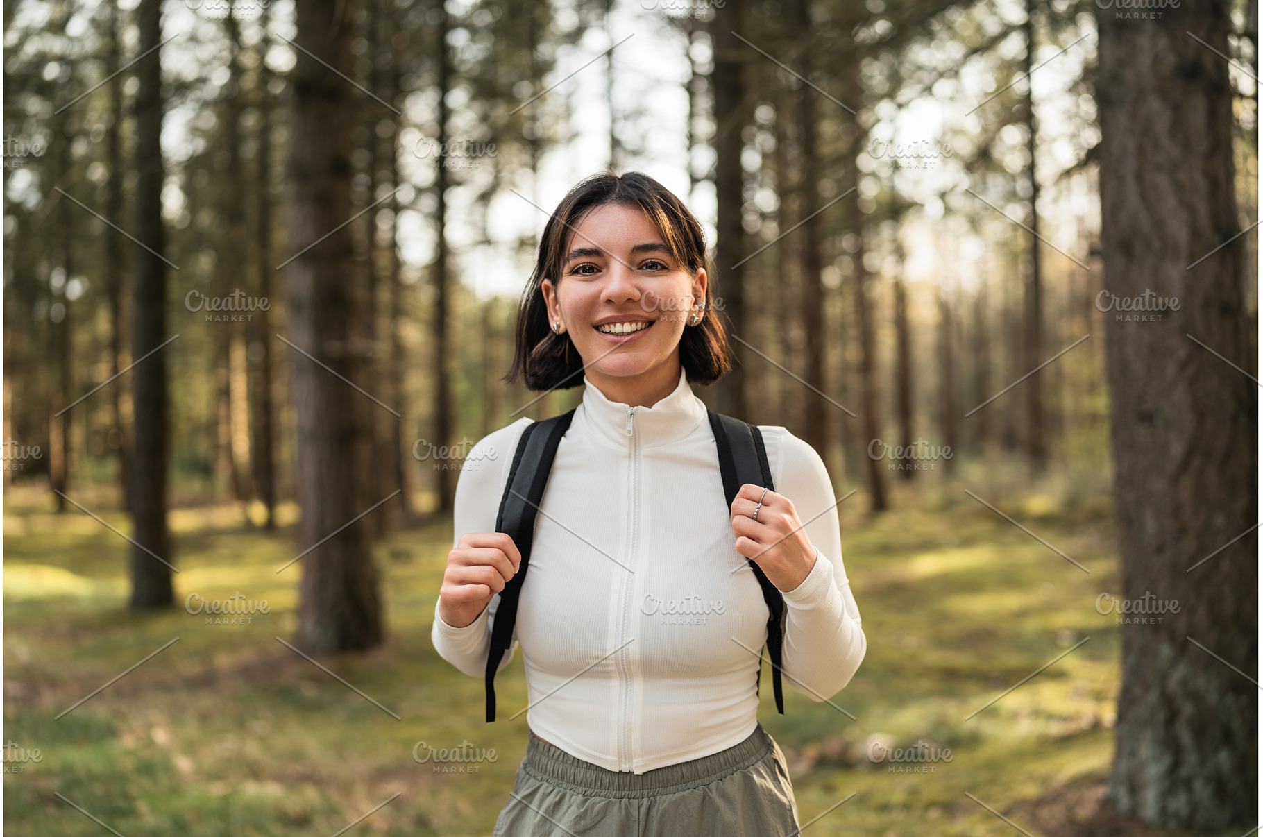 Hiking woman in a white top and, a Beauty & Fashion Photo by AD Stock Images