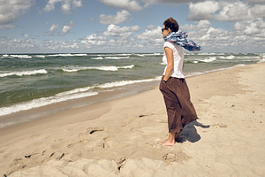 Middle aged woman looking at sea, a Person Photo by BOOCYS