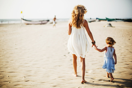 Mother and daughter on the beach stock photo containing beach and mother