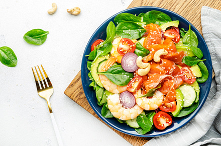 Ketogenic diet salad with salmon, shrimp, avocado, spinach, cucu, a Food & Drink Photo by 5PH