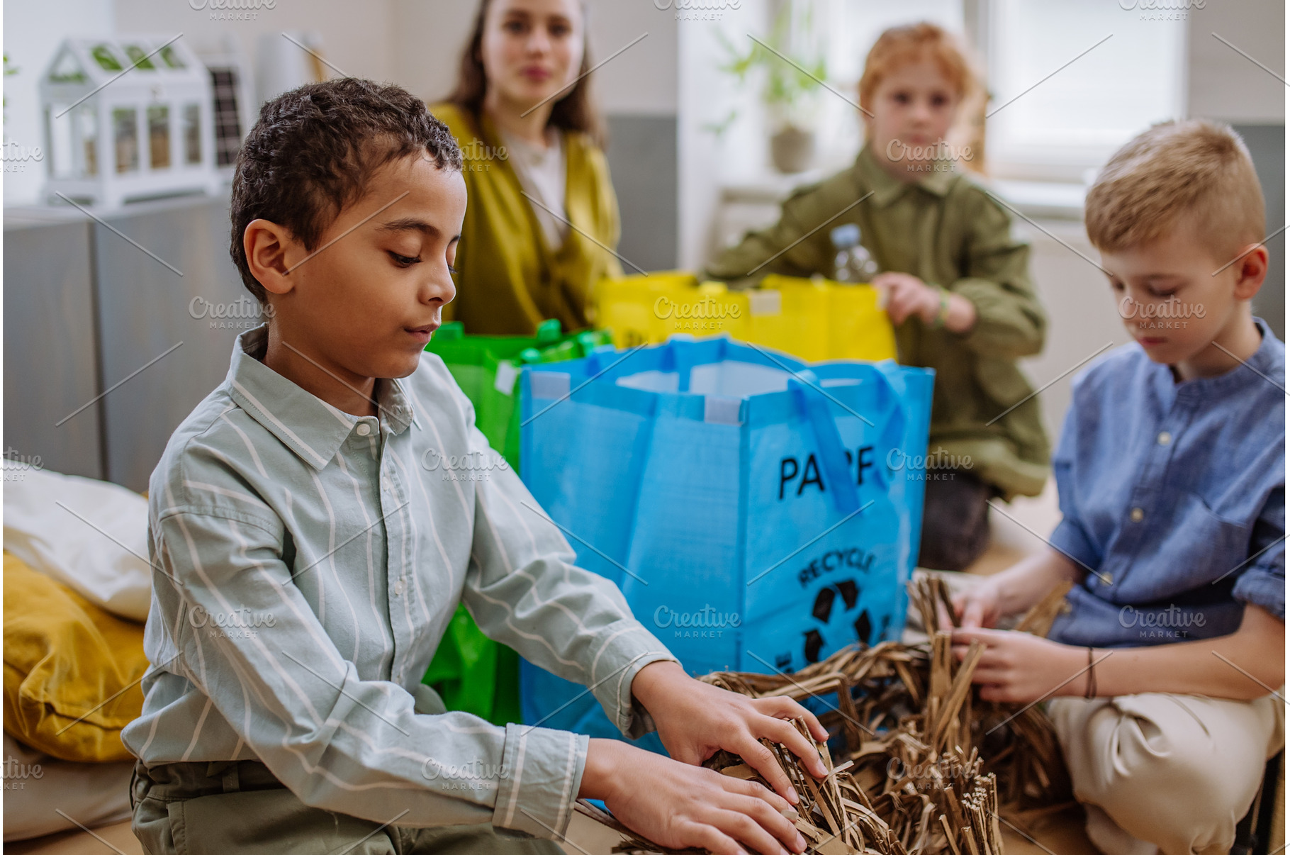 Children separating rubish in to, a School & Education Photo by HalfPoint