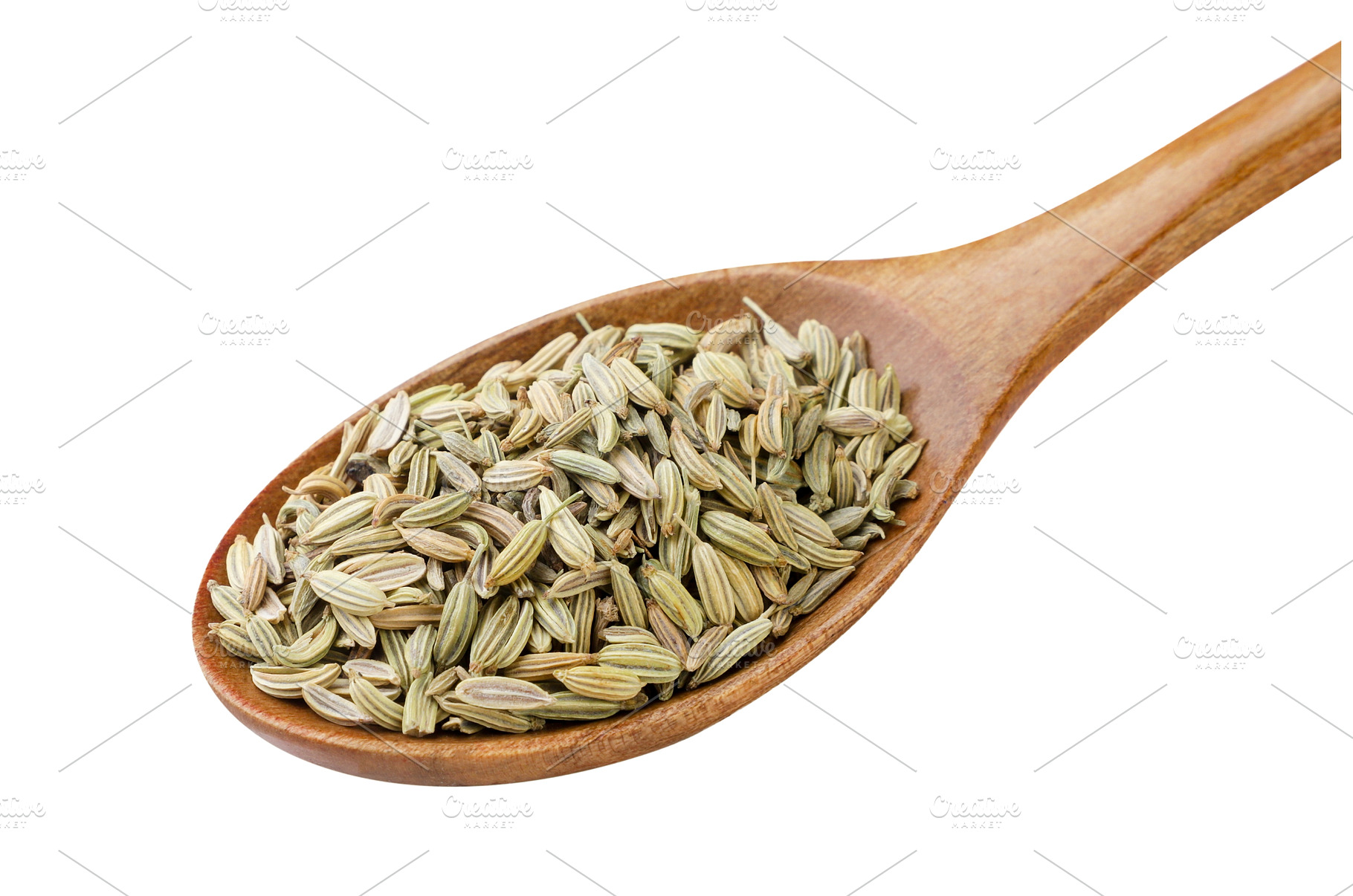 Fennel seeds in a wooden spoon close, a Food & Drink Photo by innakreativ