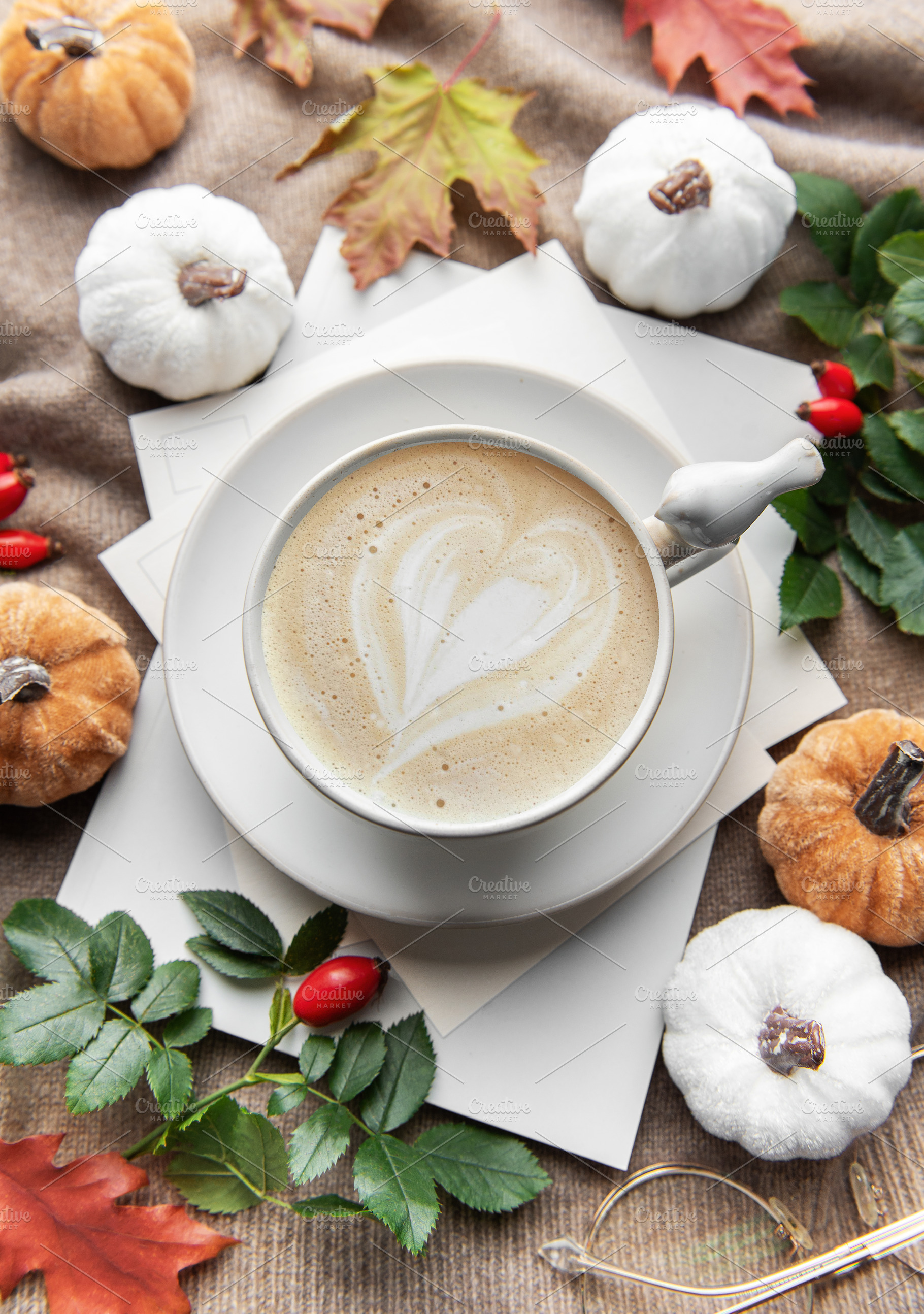 Autumn latte art heart with fall pumpkins and leaves, a Holiday Photo by Olena Rudo