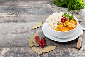 Massaman curry in bowl on wooden table. Traditional Thai food recipe., a Food & Drink Photo by etorres69