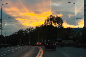 Urban road during sunset with beautiful sky and glowing horizon, a Photo by AS photostudio
