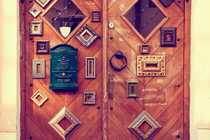 Doors decorated with picture frames, an Architecture Photo by BOOCYS