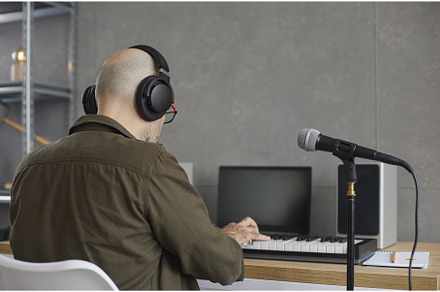 Unrecognizable male musician with, a Person Photo by StudioRomantic