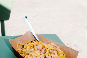 spaghetti alla carbonara in a brown paper bowl, a Photo by Nito