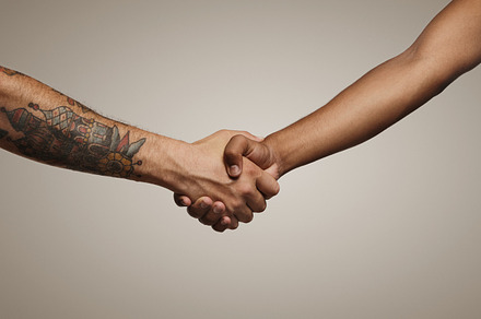 Close up shot of a handshake featuring isolated, human, and handshake, a Person Photo by DeRepente