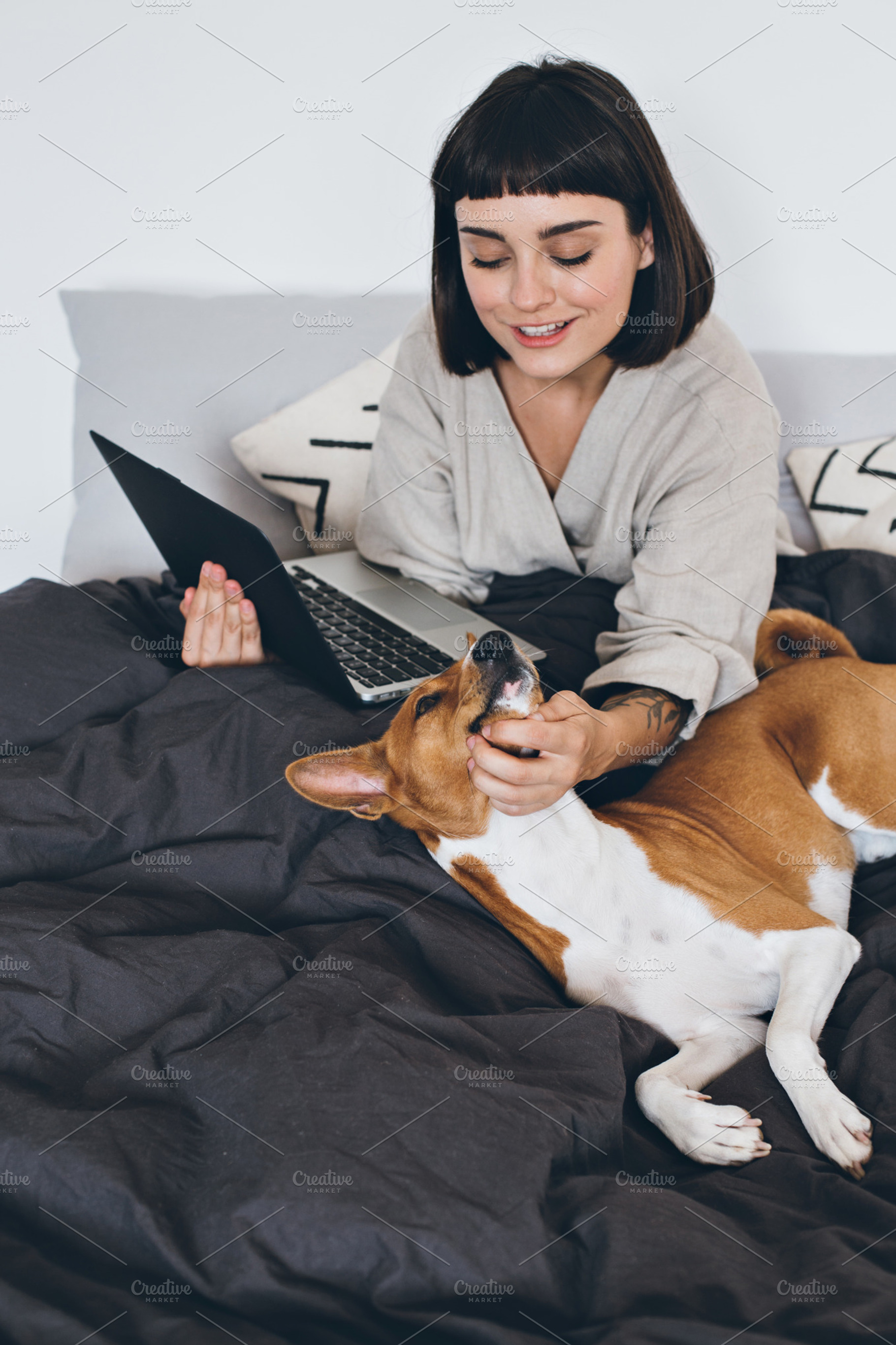 Freelancer works from home with dog featuring love, dog, and woman, a Technology Photo by DeRepente