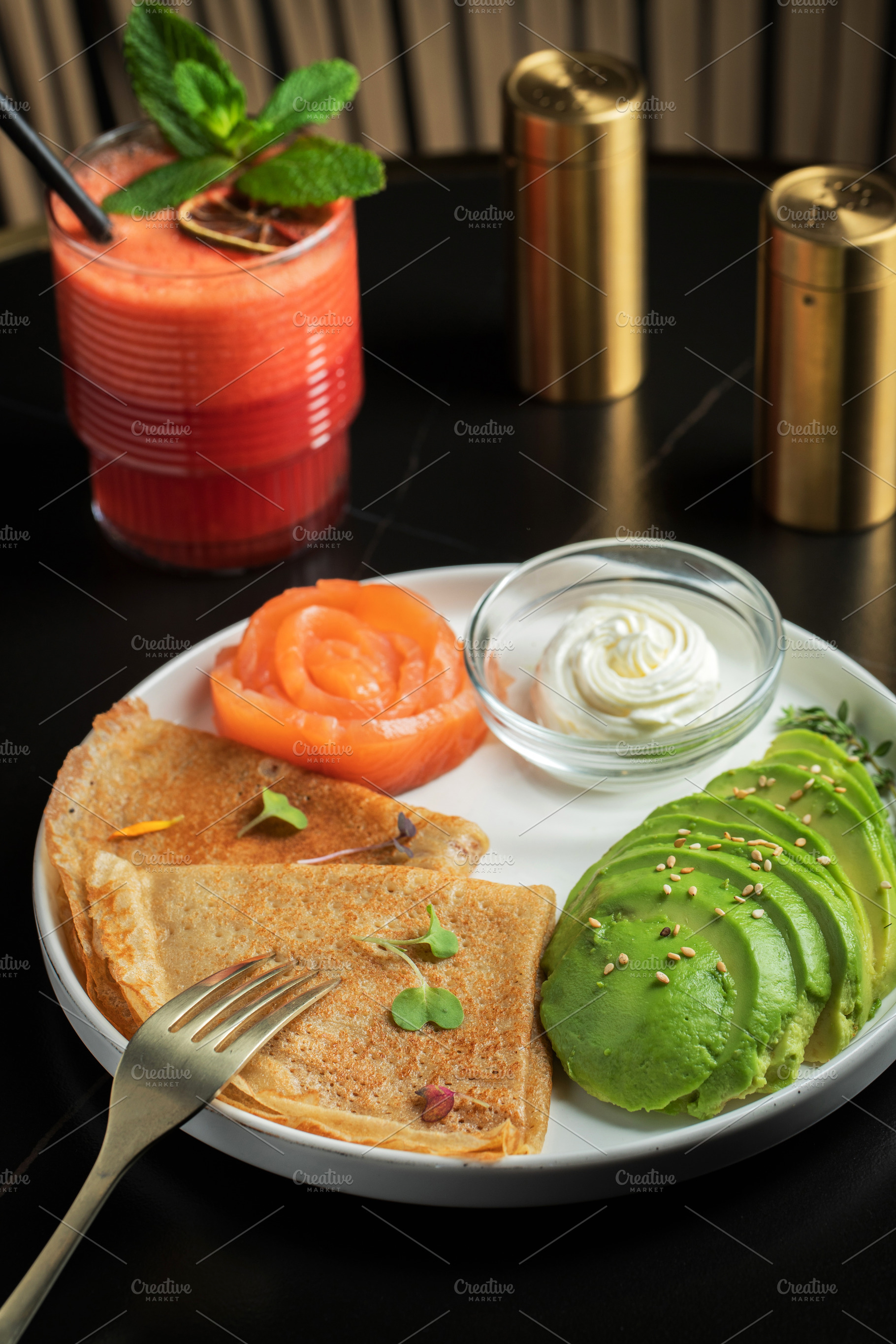 Roasted thin pancakes with smoked salmon and sauce, a Food & Drink Photo by Budarinphoto