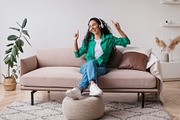Relaxed Lady Listening To Music Wearing Wireless Headphones At Home, a Photo by Prostock-Studio (Thumbnail 4 of 4)