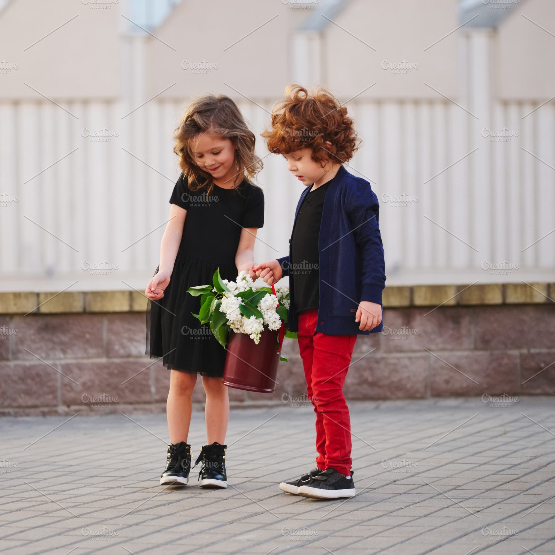 little boy and girl with big lilac, a Person Photo by AlohaHawaii