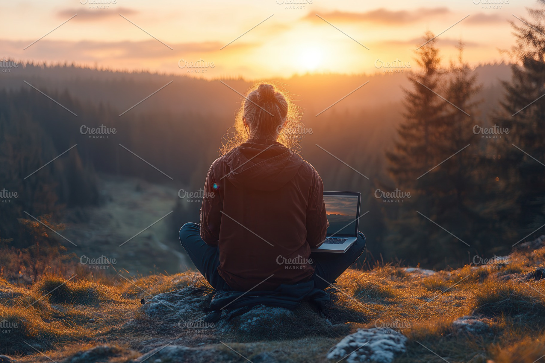 Person working on laptop outdoors at, a Photo by Tanuart