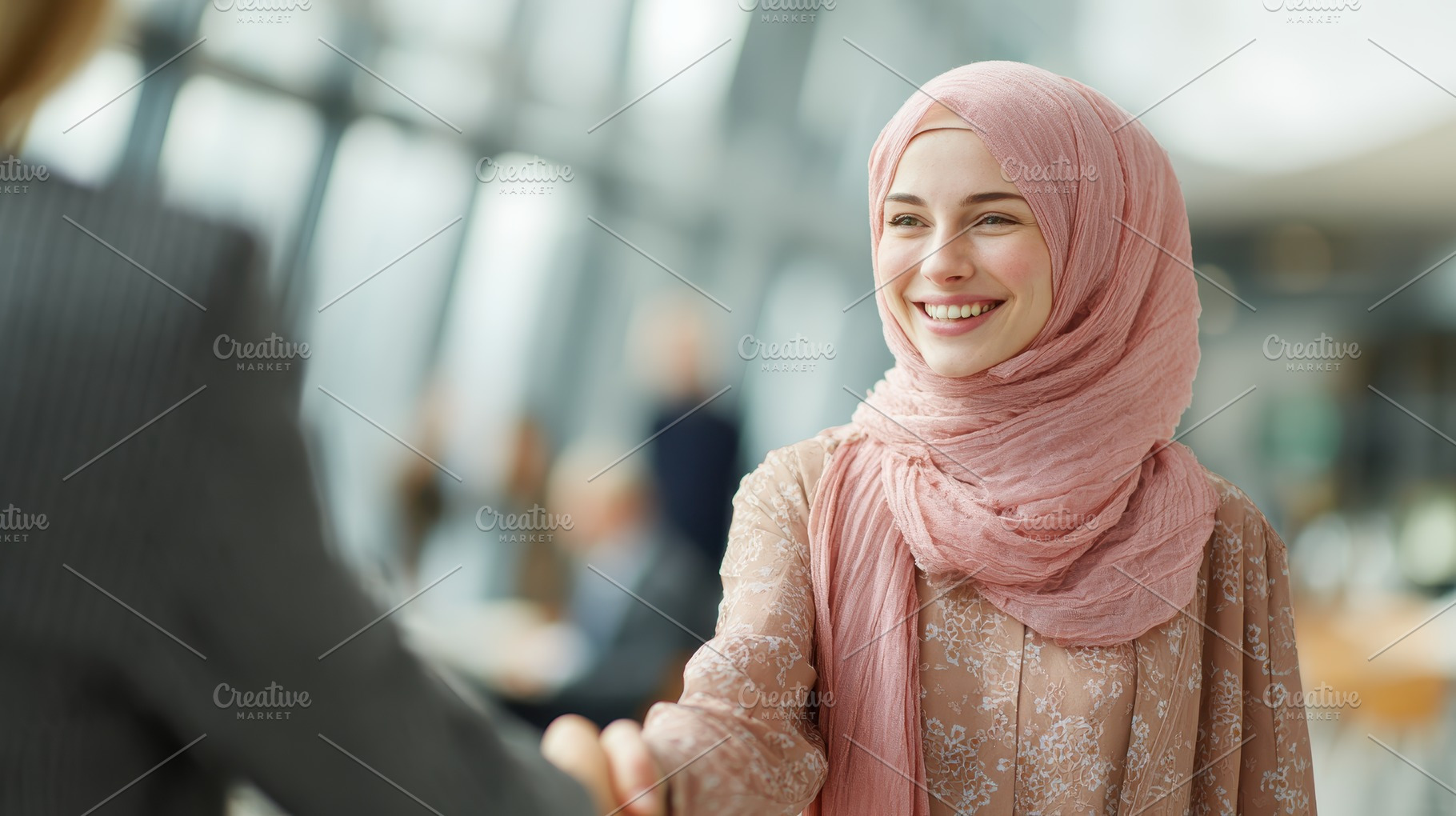 Smiling Muslim woman in hijab shakin, a Photo by Pixeness Studio