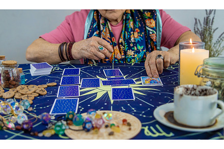 Fortune teller reads tarot cards, a Person Photo by yanadjana