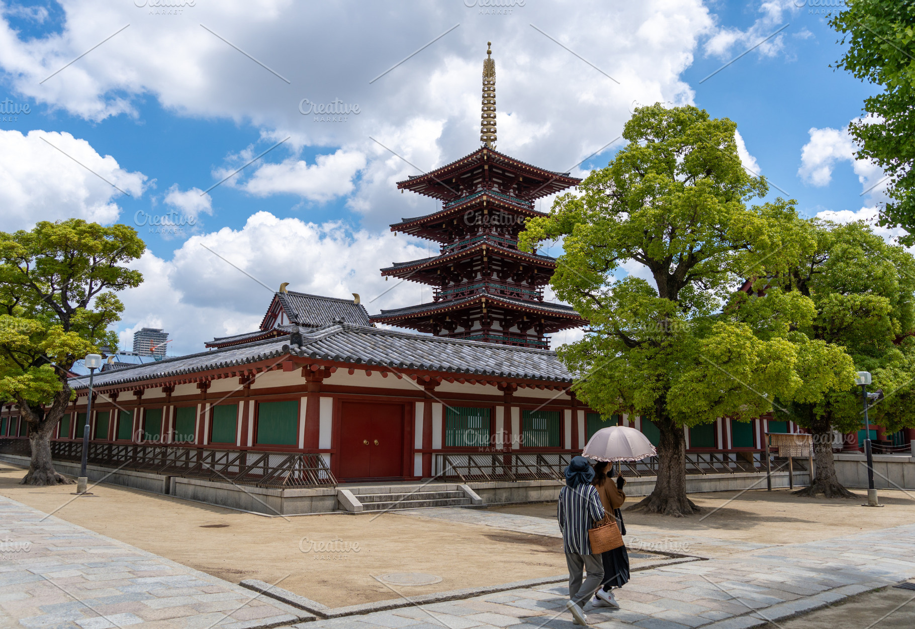 Women walking near pagoda at Shitenno-ji Temple in Osaka, Japan, an Architecture Photo by GoodGoods
