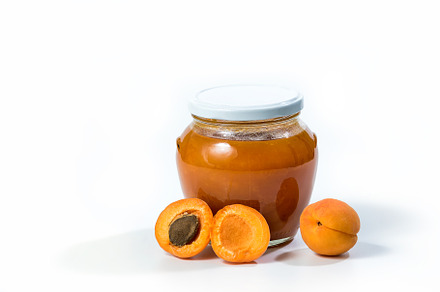 Apricot jam in a jar, a Background Photo by wr7 Media