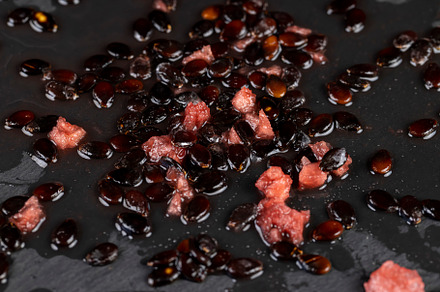 watermelon seeds on black slate, watermelon seeds after peeling the pulp on a b, a Photo by MyPhotos