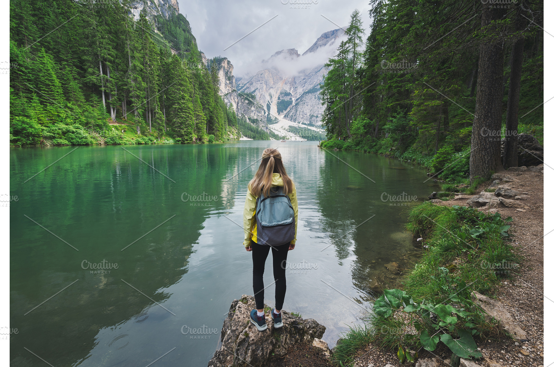 Young woman with backpack on the, a Person Photo by den-belitsky