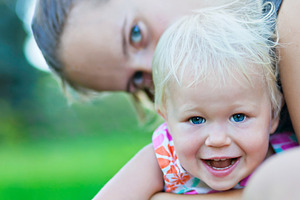 Baby and mother playing, a Photo by saiko3p