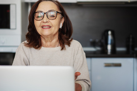 Woman with laptop at home