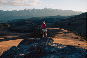 Woman Admiring Mountain Landscape at, a Person Photo by Jan Jack Russo Media