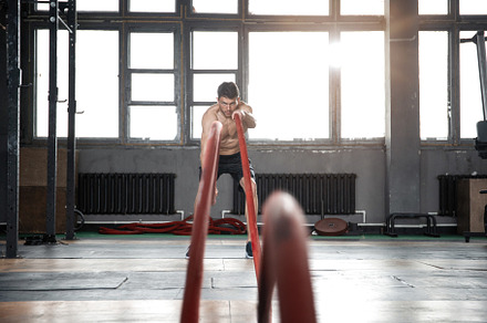 man with battle rope doing exercise, a Sports & Recreation Photo by OPOLJA
