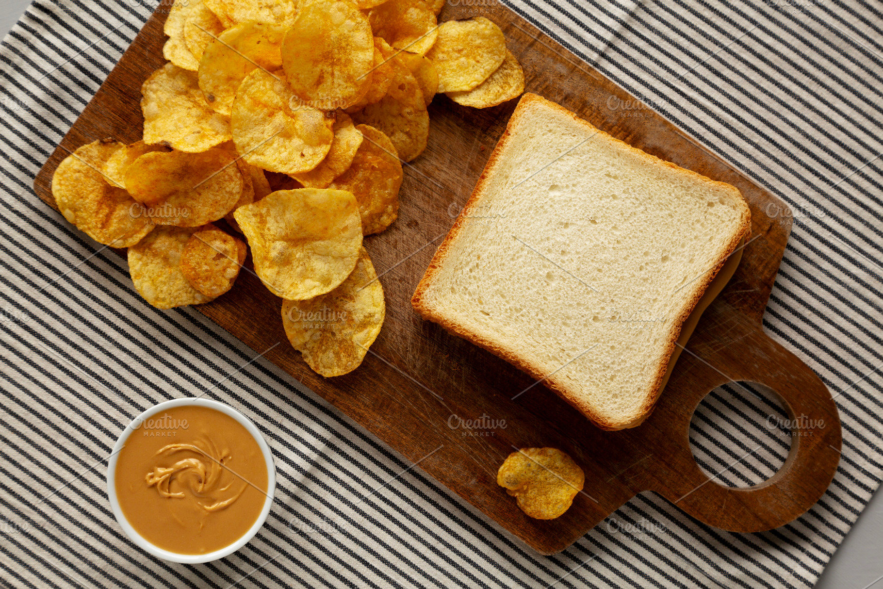 Homemade American Peanut Butter Sandwich on a Wooden Board, top, a Food & Drink Photo by LiudmylaChuhunova