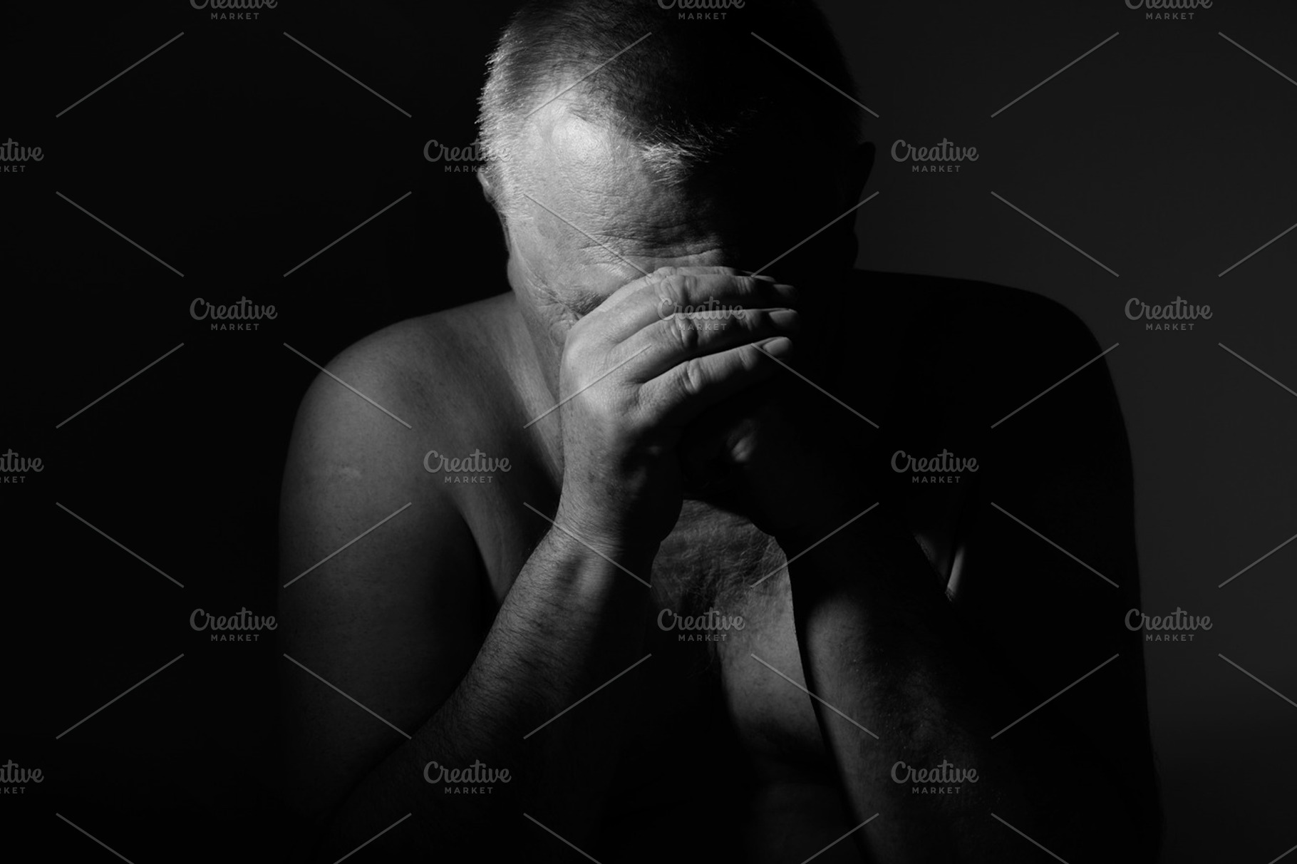 Sad man with hands on face