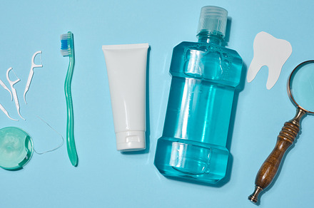 A set of oral hygiene products and items including a toothbrush,