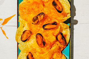 mussels and chips coated with escabeche sauce, a Photo by Nito
