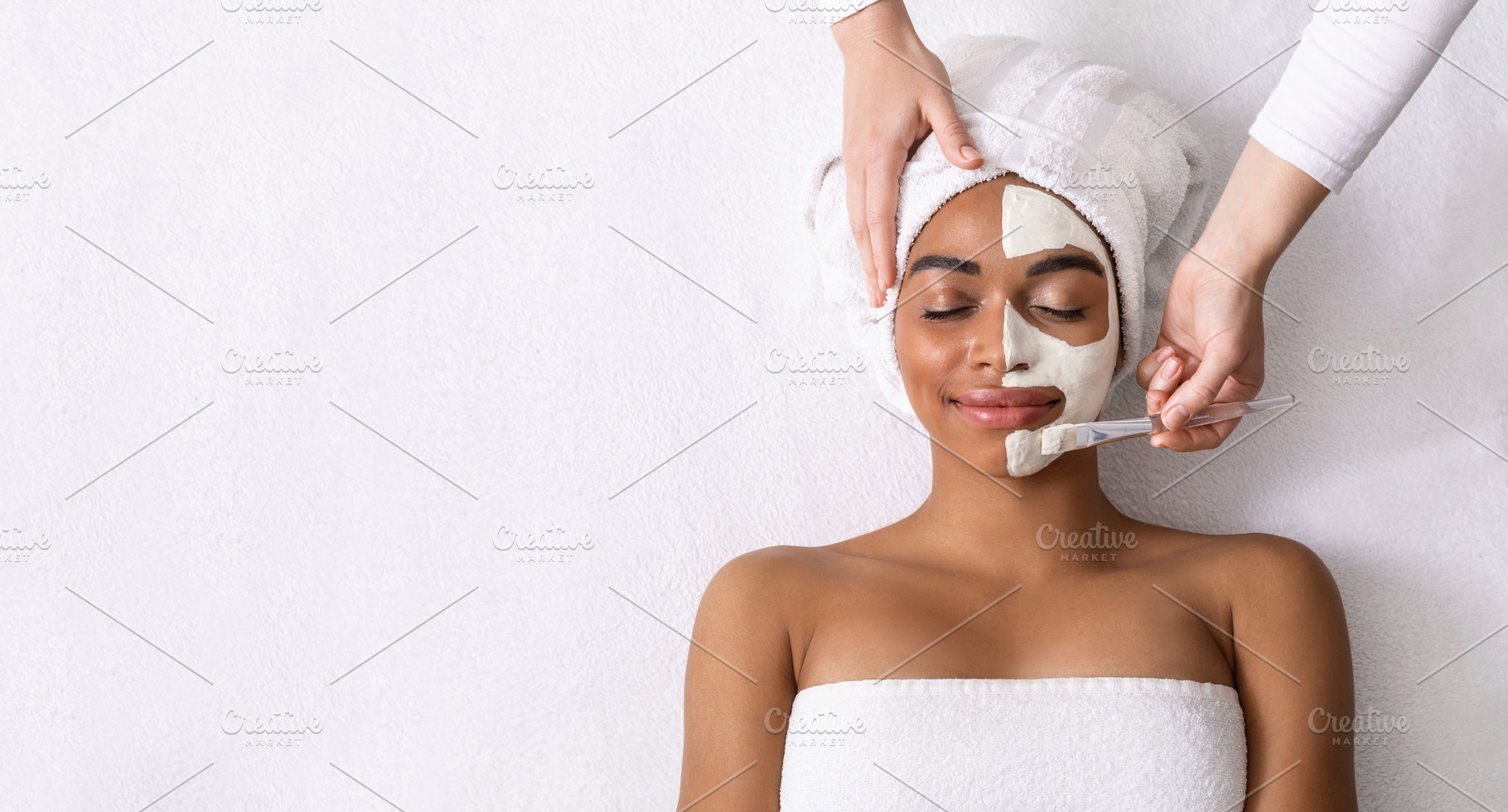 Beautician applying white mask on ha, a Photo by Prostock-Studio