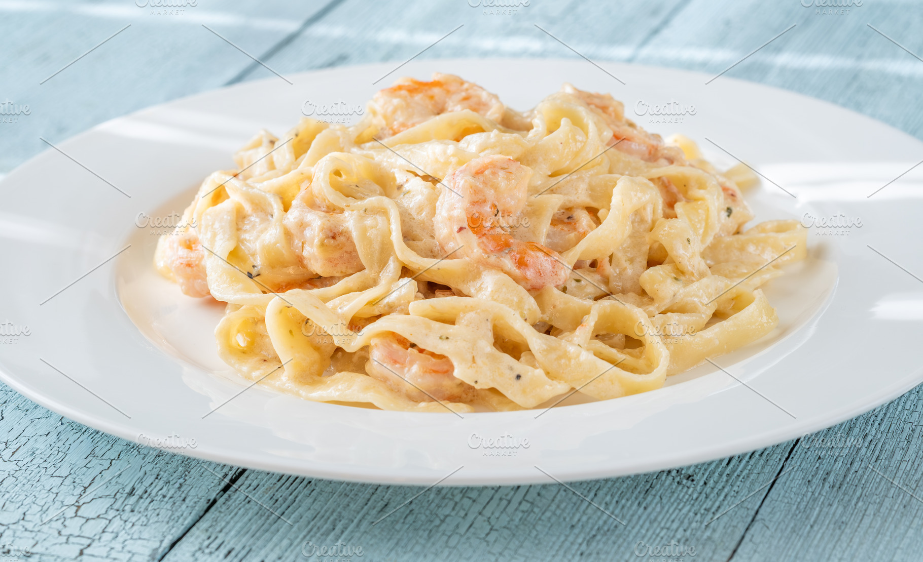 Creamy fettuccine shrimp pasta, a Food & Drink Photo by Alexander Prokopenko