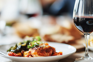 Glass of red wine served with, a Food & Drink Photo by MistyDay