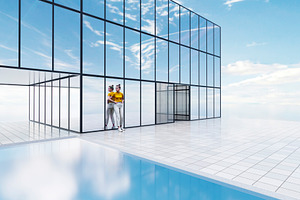 Woman standing near modern glass building and pool, an Architecture Photo by RF Images
