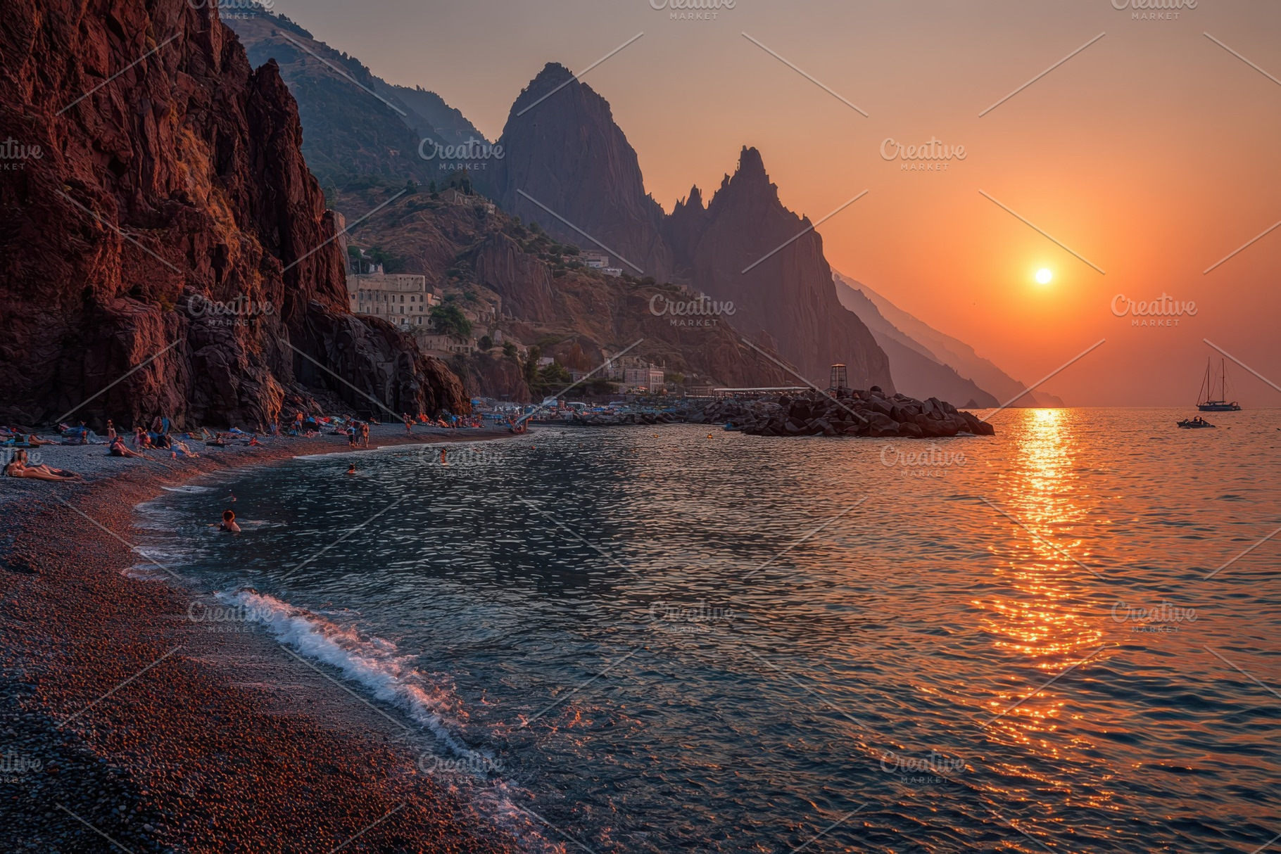 Sunset over beach and dramatic cliff, a Photo by Pixeness Studio