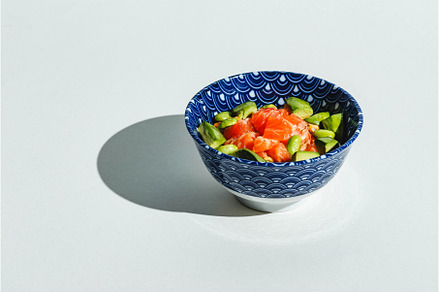 Poke bowl with rice, avocado, a Food & Drink Photo by Irina Burakova