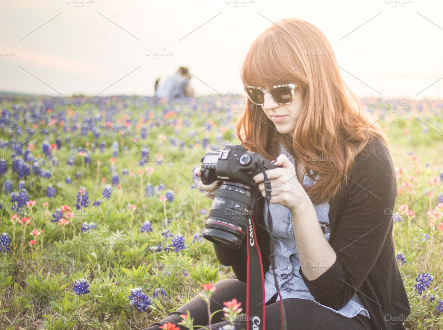 Female Photographer In Flowers