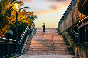Female runner training up stairs over in urban runway on sunset, a Sports & Recreation Photo by davidpereiras