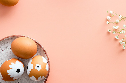 Easter vertical banner or poster design. Painted Easter eggs, bunny, flowers on, a Holiday Photo by photoguns