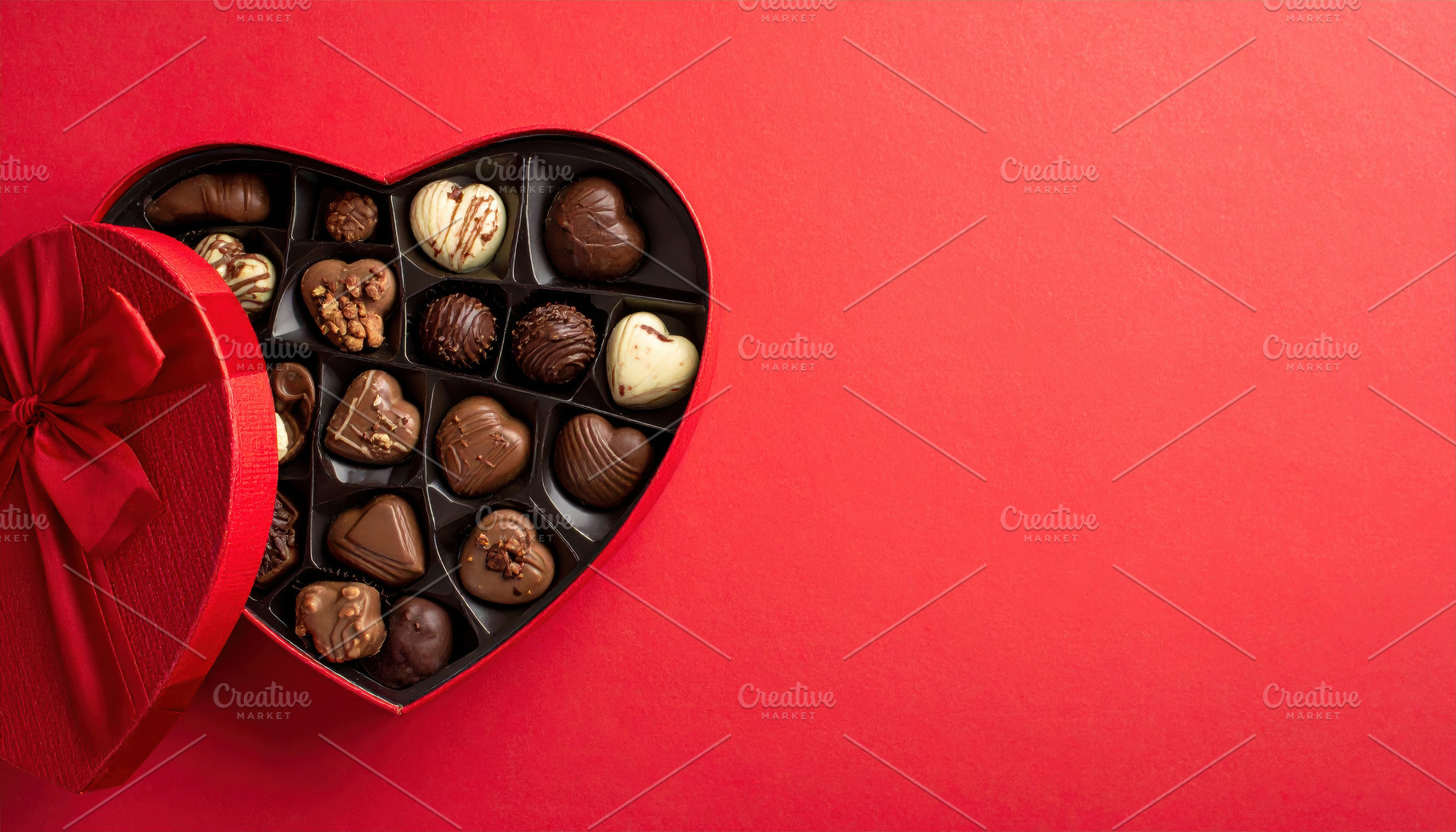 Heart-Shaped Chocolate Box on Red Background, a Food & Drink Photo by Davizro's Market