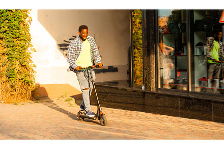 The young man with a scooter is, a Person Photo by oksix