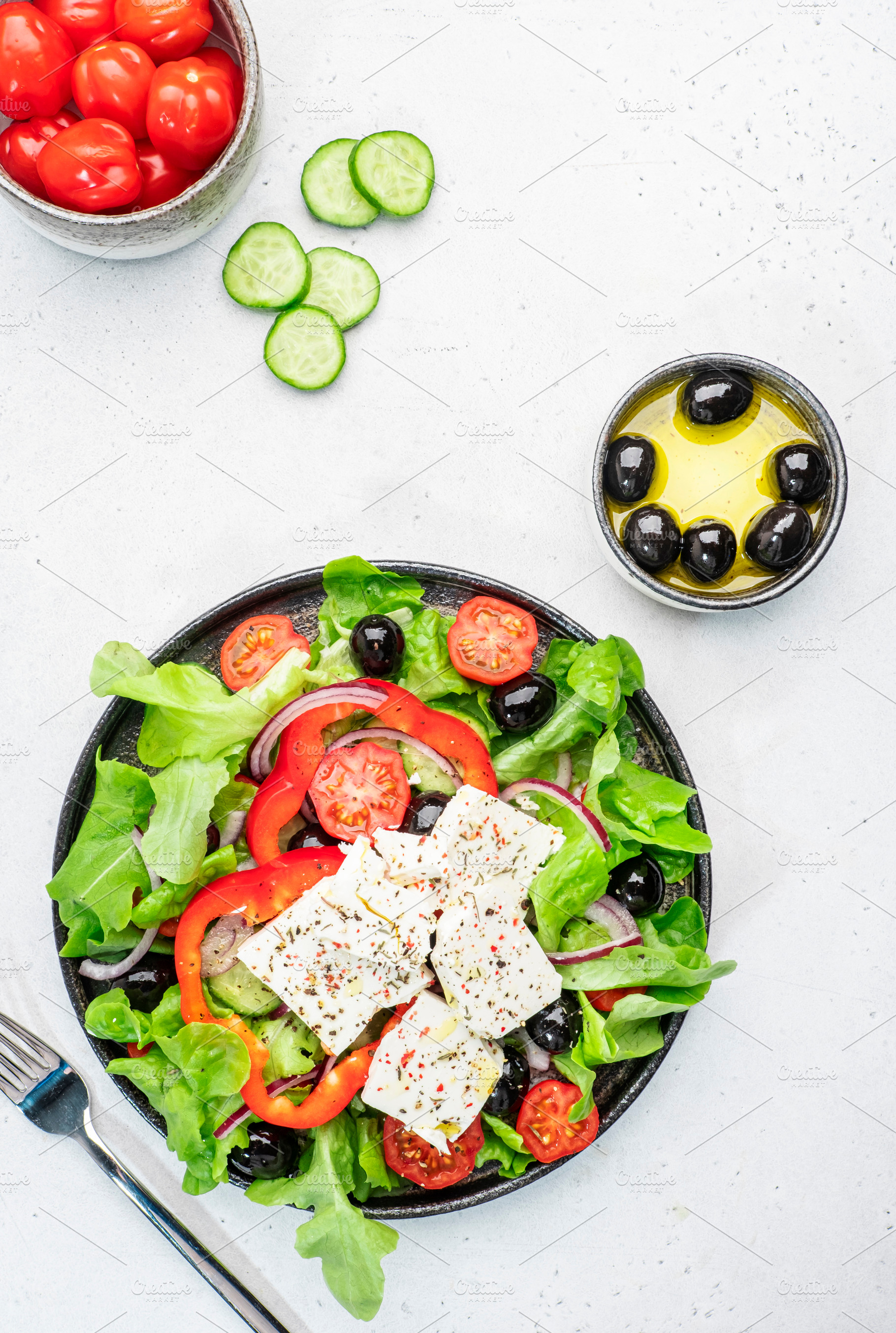 Vegetable greek salad with feta cheese, olives, tomatoes, paprik, a Food & Drink Photo by 5PH