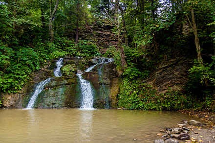 Forest waterfalls in the mountains, a Nature Photo by Photostock