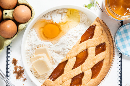 half a ready-made Italian crostat pie with jam and half a pastry, a Food & Drink Photo by IriGri