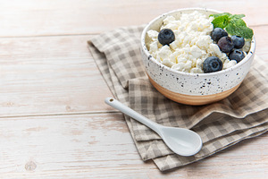 Cottage cheese with blueberries and mint for a healthy breakfast, a Food & Drink Photo by Olena Rudo