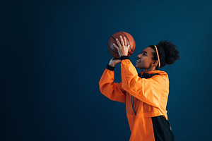Basketball player in orange cloth, a Sports & Recreation Photo by Artem Varnitsin