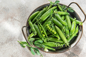 Fresh green peas in rustic bowl healthy food concept, a Food & Drink Photo by Olena Rudo