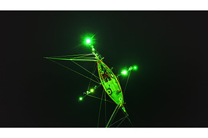 Squid fishing boat illuminating the, a Transportation Photo by Goinyk